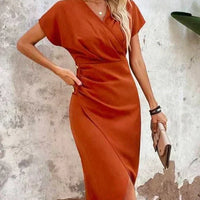 Oranje midi jurk met v-hals – Ruby